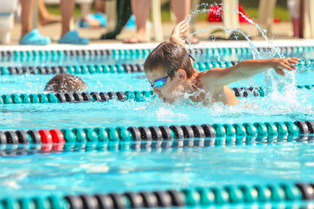 Boy swimming Butterfly in a race